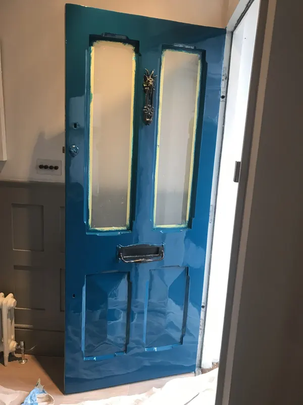 Existing entrance door being renewed with a high-gloss finish