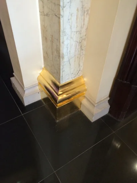 Finished gold-leaf detailing at floor level